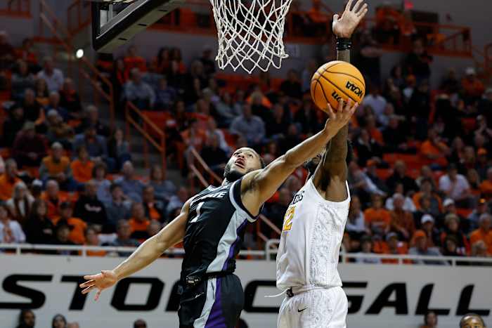 Kansas State Wildcats guard Markquis Nowell (1) goes up for a basket in front of Oklahoma State Cowboys forward Kalib Boone